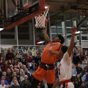 Marquise Kennedy (24) of Bro. Rice makes an easy two points against St. Rita Tuesday 12-04-18 Robinson/For Sun-Times