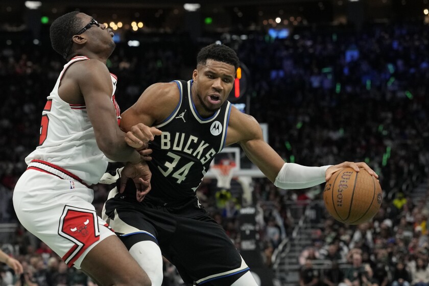 Giannis Antetokounmpo of the Milwaukee Bucks dribbles the ball against Jalen Smith of the Bulls in the fourth quarter of the Emirates NBA Cup game at Fiserv Forum on Nov. 7, 2025, in Milwaukee, Wisconsin.