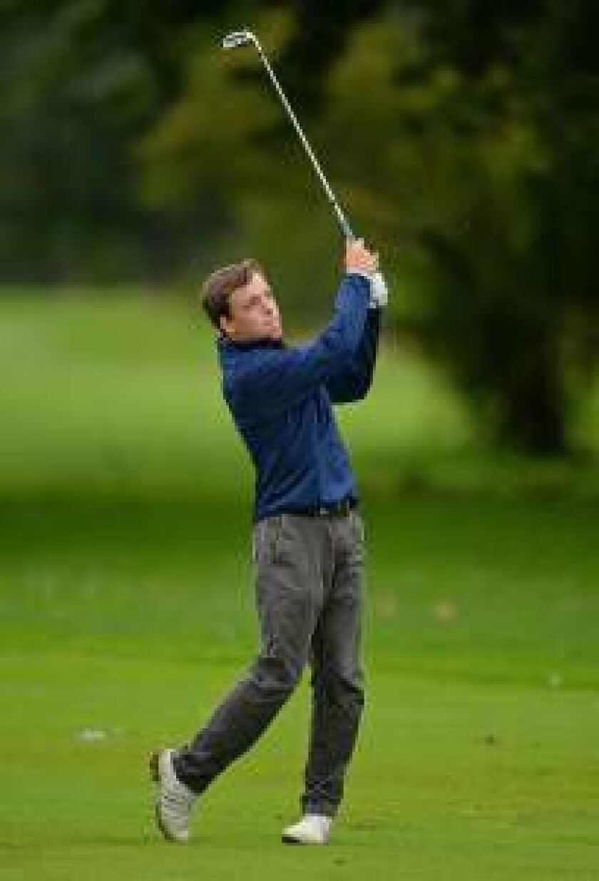 Evanston senior Bill Nondorf watches his shot on Sept. 11 in Winnetka during a dual with New Trier. | Brian O’Mahoney/for Sun-Times Media