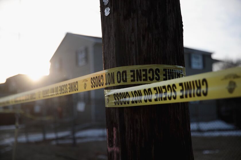 Crime scene tape surrounds the Shetland Business Park in Aurora after five people were killed and five police officers were wounded by a former employee.