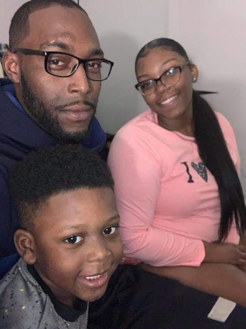 “Society has dehumanized our children in this violence,” Candace Henley, founder and executive director of the Blue Hat Foundation, says of losing her 27-year-old nephew, Joseph Barbee, to Chicago’s 2021 gun violence bloodbath. The father of two, here with his son Javari, and sister, Zoraya Logan, was killed July 15 in the 7700 block of South Seeley Avenue.