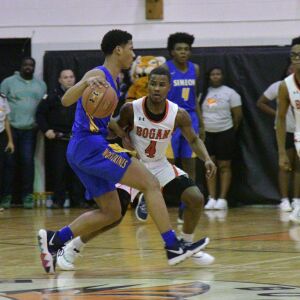 Bogan’s Jordan Booker (4) defends Simeon’s Byrce Hall (5). Worsom Robinson/For the Sun-Times.