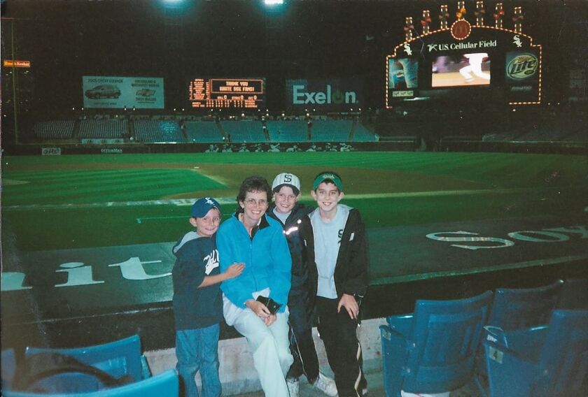 Meg Rooney with her sons (from left) Dan, Jack and Ned after a White Sox game.