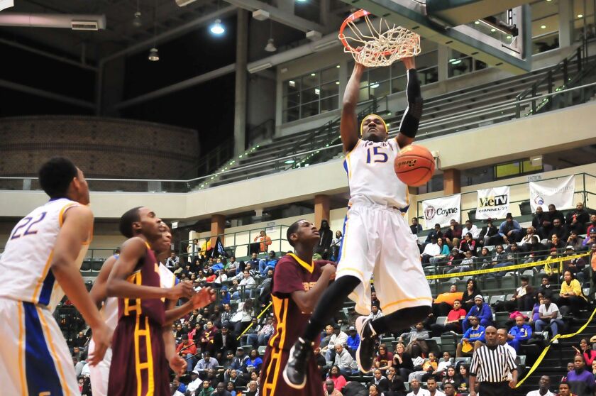 Simeon’s Steve Taylor powers a two-handed dunk against Marshall. Sun-times file photo.
