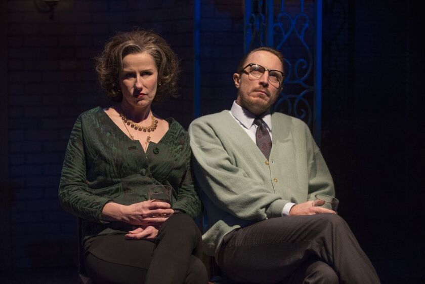 Karen Janes Woditsch as Martha and John Hoogenakker as George in a scene from “Death of a Streetcar Named Virginia Woolf: A Parody,” produced at Writers Theatre in conjunction with Second City. | Michael Brosilow