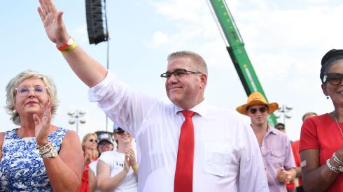 Illinois gubernatorial hopeful Darren Bailey waves to the crowd during a Save America Rally with Donald Trump at the Adams County (Ill.) Fairgrounds on June 25, 2022 in Mendon, Illinois.