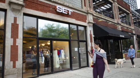 Pedestrians walk by the retail store Set at 946 W. Randolph St.