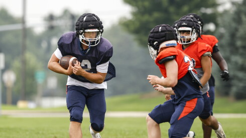 Oswego’s Graham Schwab (2) works a drill during preseason practice.