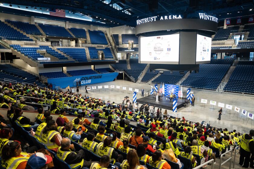 Safe Passage workers are celebrated at Wintrust Arena in the South Loop, Tuesday, Aug. 15, 2023.