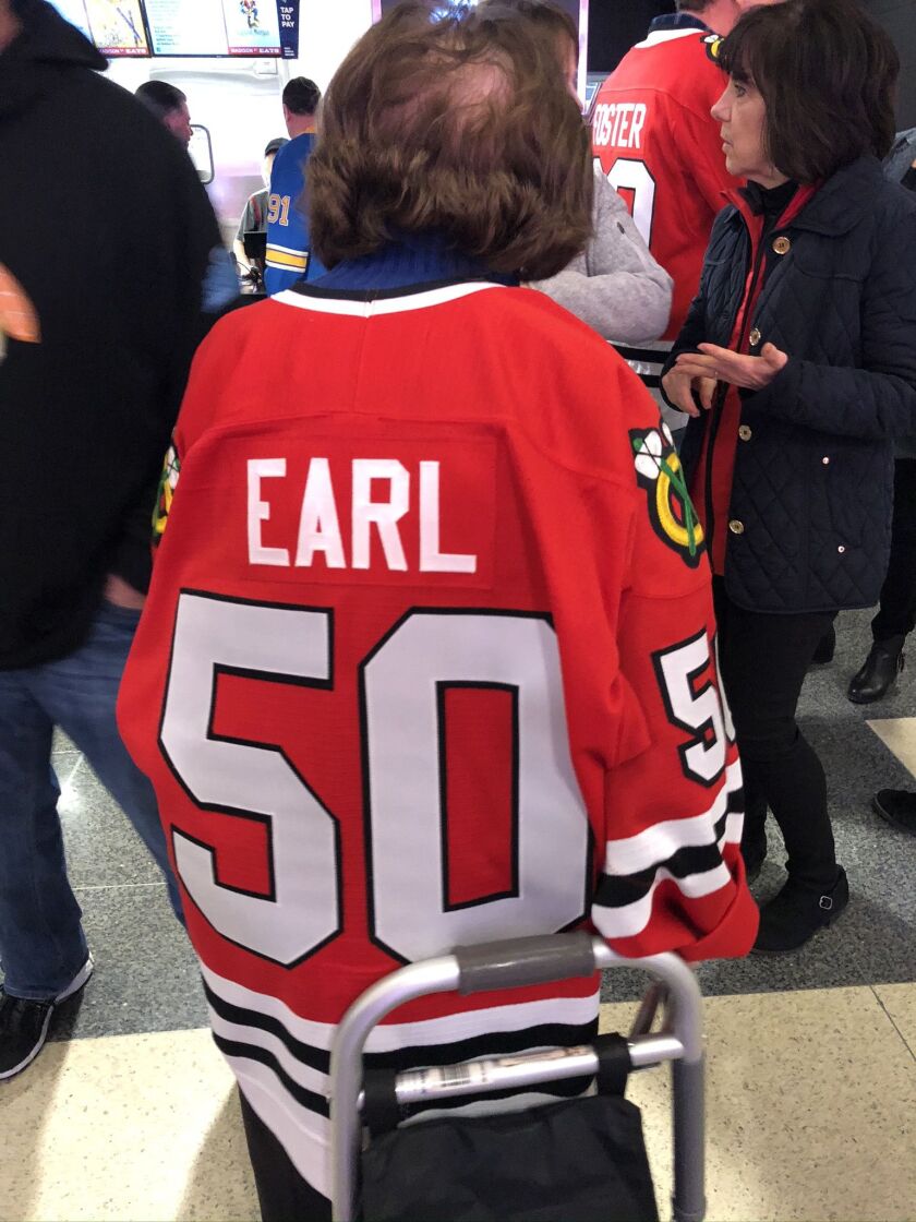 RoseLee Deutsch in her husband’s Hawks jersey at last Sunday’s Blackhawks game, It has the number 50 because it was a gift from the team for the couple’s golden anniversary.