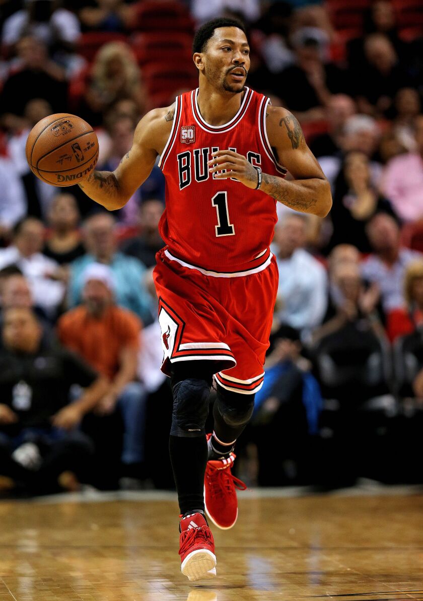 Derrick Rose drives to the basket during a game against the Miami Heat at American Airlines Arena. | Mike Ehrmann/Getty Images
