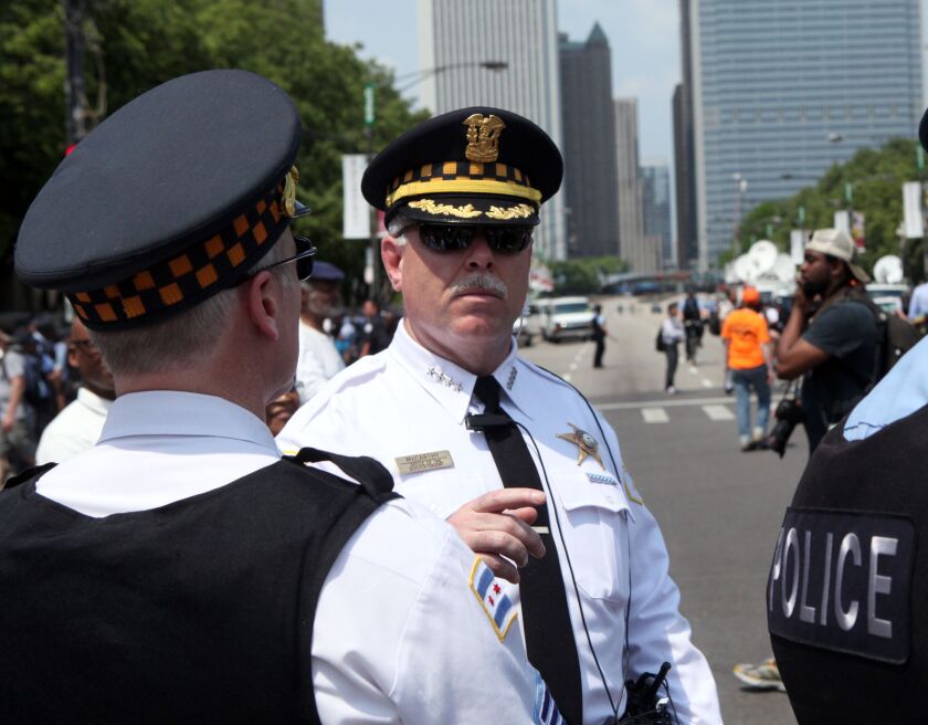 Former Chicago Police Supt. Garry McCarthy talks with officers before a protest march during the NATO summit in Chicago on May 20, 2012