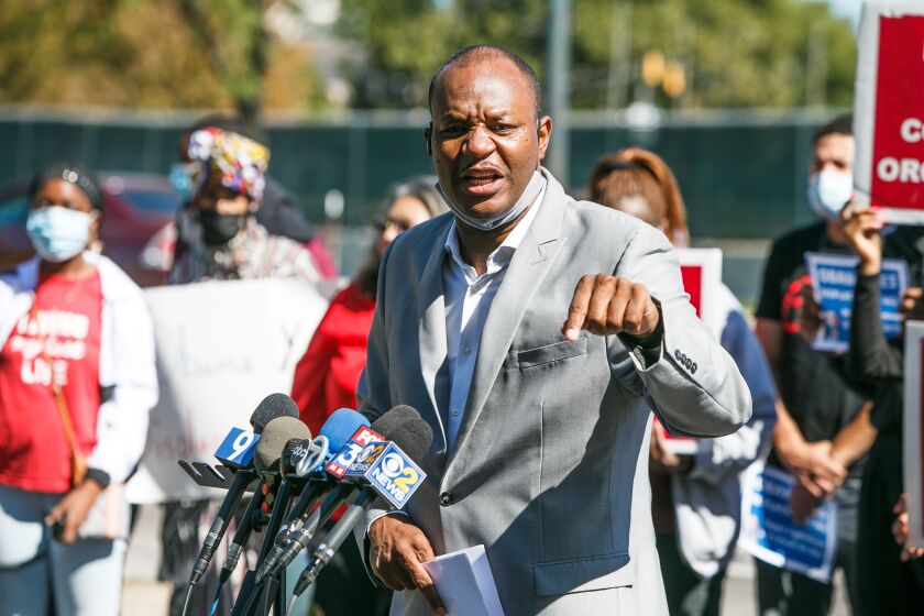 Shannon Bennet executive director of the Kenwood-Oakland Community Organization speaks on the corner of 60th and Stoney Island in Hyde Park, Tuesday afternoon, Sept. 28, 2021.