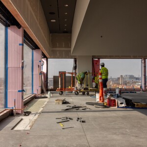 Workers build the interior of the Nelson Mandela Skyroom on the eighth floor of the Obama Presidential Center.