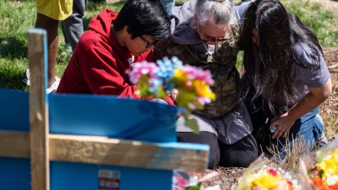 NASHVILLE, TN - MARCH 28: Mourners pray at the entrance of The Covenant School on March 28, 2023 in Nashville, Tennessee. According to reports, three students and three adults were killed by the 28-year-old shooter on Monday. (Photo by Seth Herald/Getty Images) ORG XMIT: 775959211