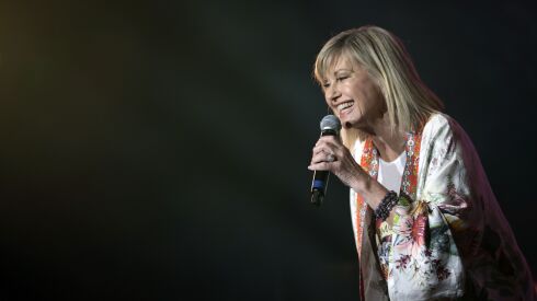 Olivia Newton-John performs during Fire Fight Australia at ANZ Stadium on February 16, 2020 in Sydney, Australia. The pop singer icon died Monday at the age of 73. 