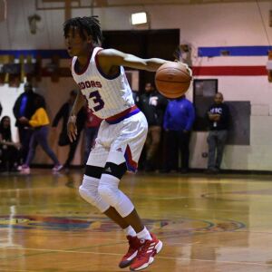Curie’s Ramean Hinton (23) dribbles the ball. Worsom Robinson/For the Sun-Times.