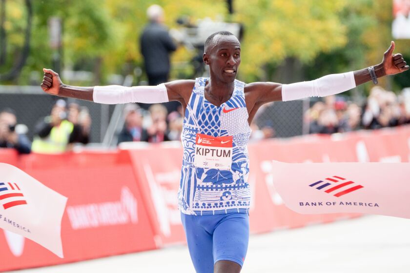 Kelvin Kiptum from Kenya, who set a new world record, crosses the finish line of the Bank of America Chicago Marathon on Oct. 8, 2023.