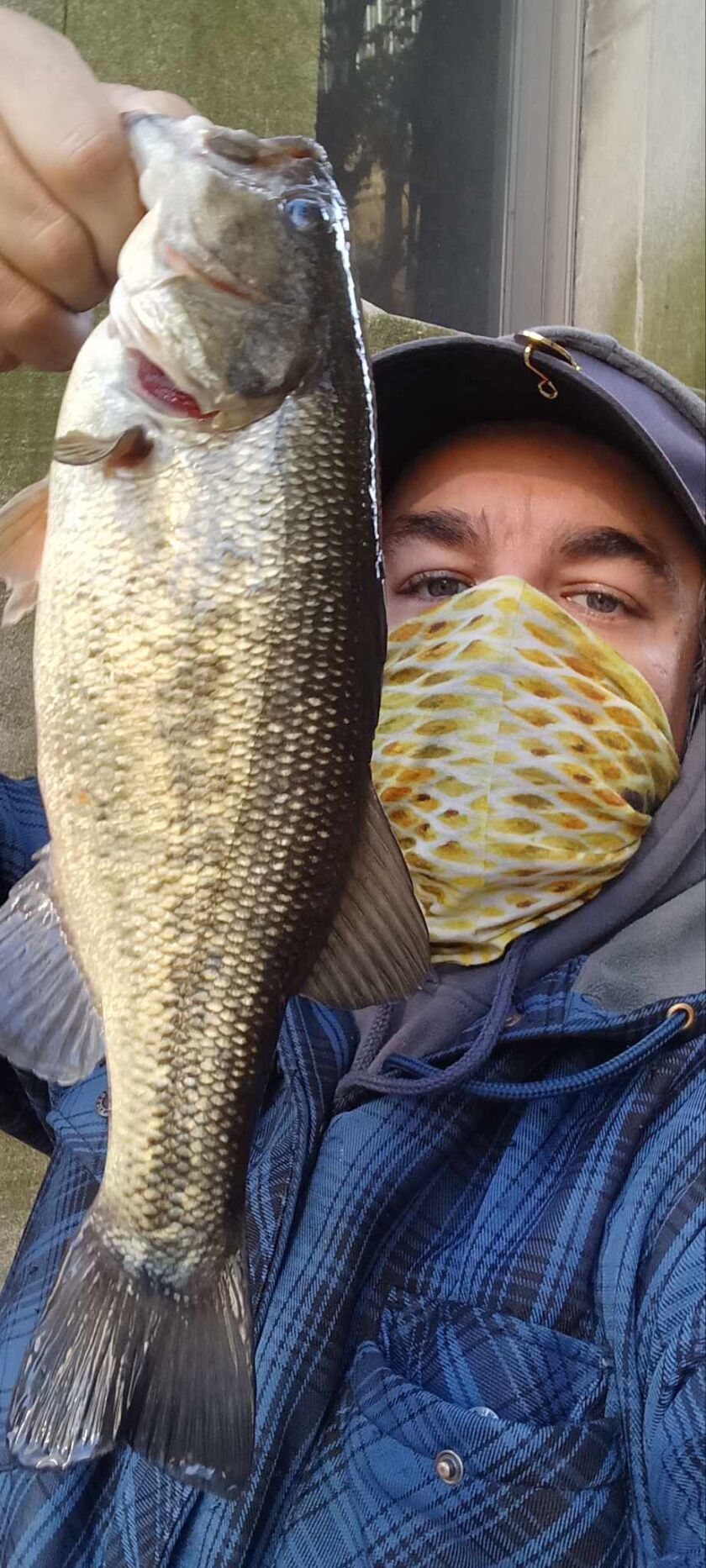 Jeffrey Williams with a late-fall largemouth bass from the Chicago River. Provided photo