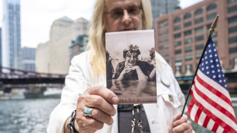 Scott E. Long holds a photo of his great aunt Mabel Dichmann, one of the 844 victims who perished 111 years ago when the S.S. Eastman rolled onto its side in the Chicago River as it was about to leave for an excursion on Lake Michigan. The disaster was marked with a ceremony on Friday on the Chicago Riverwalk near the Clark Street bridge.Tyler Pasciak LaRiviere/Sun-Times