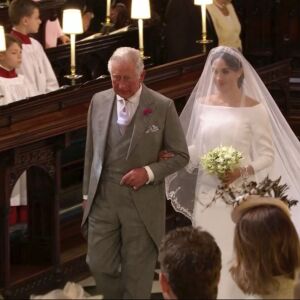 In this frame from video, Meghan Markle walks down the aisle with Prince Charles. | UK Pool/Sky News via AP