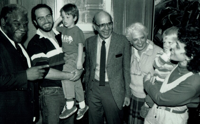 Hal Baron with Mayor Harold Washington (left); Mr. Baron’s wife Paula next to her husband, and the Barons’ daughter Marnie Saeugling and her husband Mike holding two of their children. | supplied photo