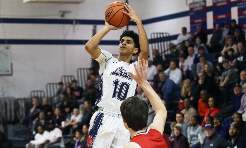 St. Viator’s Trey Calvin (10) rises up for a three-point shot againt Marist. Allen Cunningham/For the Sun-Times.