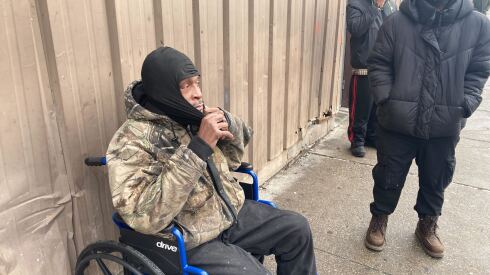 Kenyatta Mays, 56, smokes a cigarette outside the Shelter Placement and Resource Center in Pilsen.