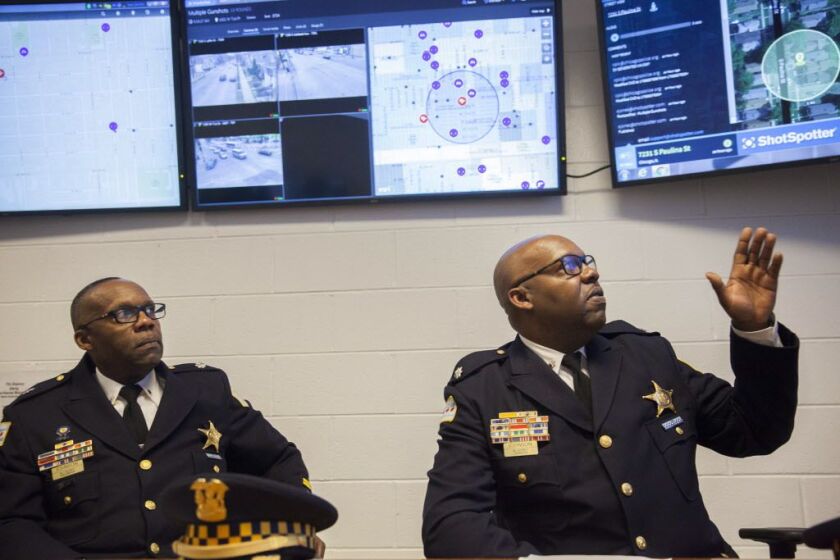 Chicago Police Cmdr. Kenneth Johnson (left) and Cmdr. Kevin Johnson talk about the crime rates in their districts. | Maria Cardona/Sun-Times