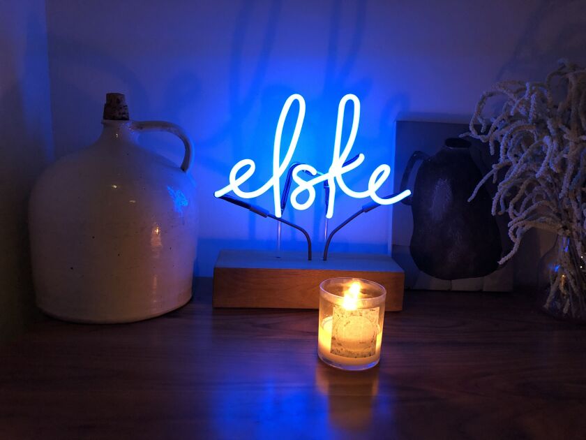 A blue neon “Elske” sign at the Chicago restaurant.
