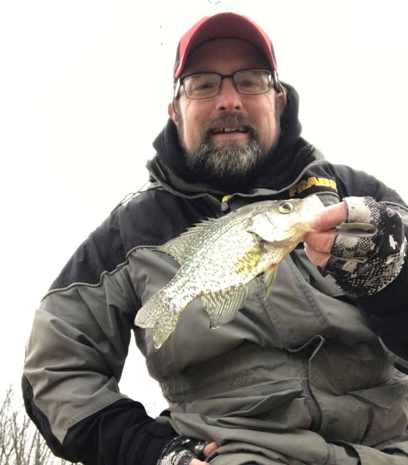 Ken “Husker” O’Malley with a crappie before local lakes iced over. Provided photo