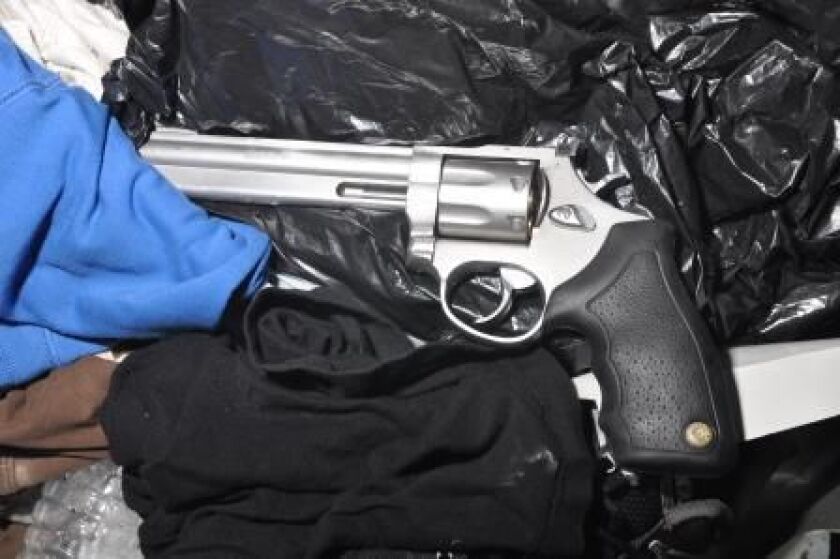 Revolver found by Evanston police in the trunk of the vehicle. | Evanston police