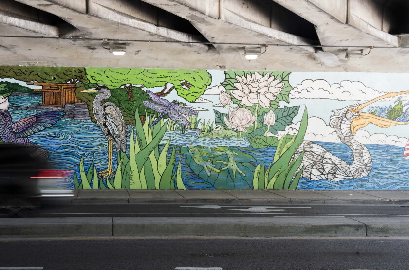 “Day into Night: Lincoln Park’s Living Canvas” is two 100-foot murals on either side of an underpass that connects Lincoln Park to North Avenue Beach.