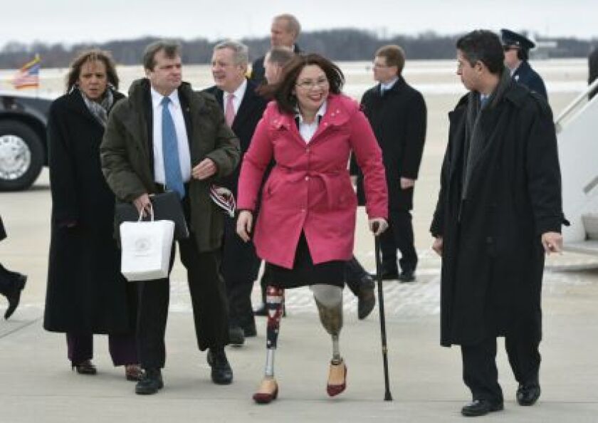 Rep. Tammy Duckworth, D-IL, walks across the tarmac upon arrival at Abraham Lincoln Capital Airport in Springfield, Illinois on February 10, 2016, after arrival with US President Barack Obama on Air Force One. AFP / Getty Images
