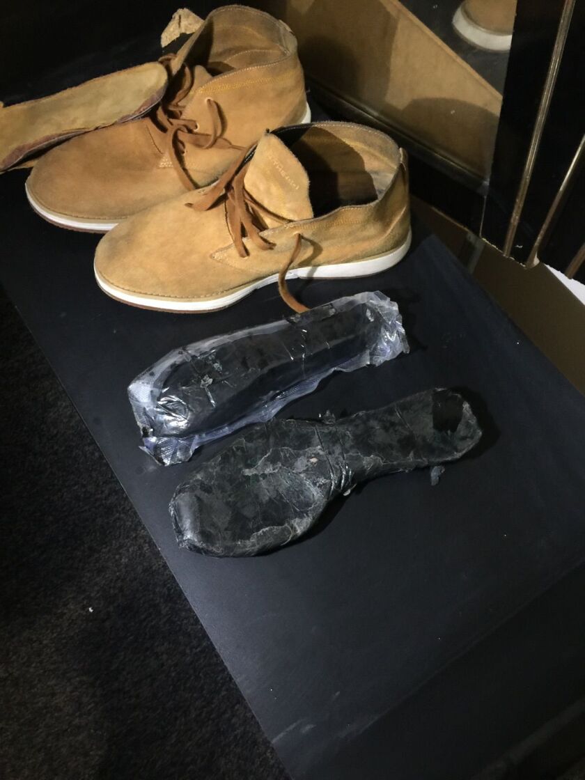 Cook County sheriff’s police found heroin in the custom-made soles of these boots. | Cook County sheriff’s office