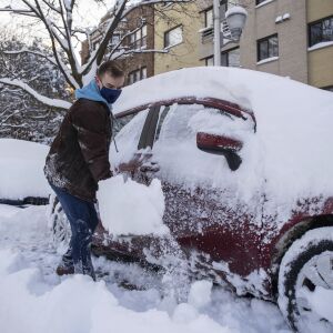 Michael Svabek digs out his car Tuesday in the Edgewater neighborhood.