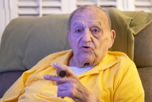 Former Bears offensive lineman John Damore, 92, watches the Bears-Rams playoff game Sunday in his Westmont home. He played for the Bears from 1957 to 1959.