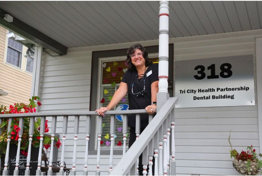 As a public health dental hygienist, Karen Webster says the process to see patients is “just a lot more efficient.” She does cleanings, takes X-rays that she sends to teledentists and applies a fluoride that can halt tooth decay.