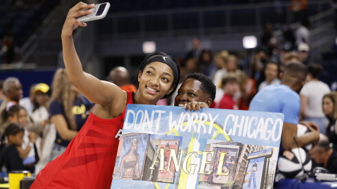 Angel Reese of the Atlanta Dream takes a selfie with a fan after the game against the Sky at Wintrust Arena on June 9, 2026.