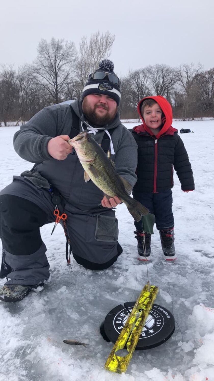 Mike Dudas front) and Logan Borscha found good ice fishing on Wampum Lake.<br>Provided