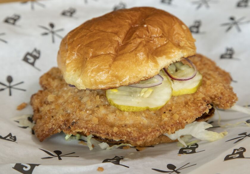 The breaded pork tenderloin sandwich at J.T.’s Genuine Sandwich Shop.