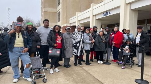 Members of an NAACP branch from East Chicago, Indiana wait to get into the House of Hope on the South Side for Jesse Jackson's service Friday.
