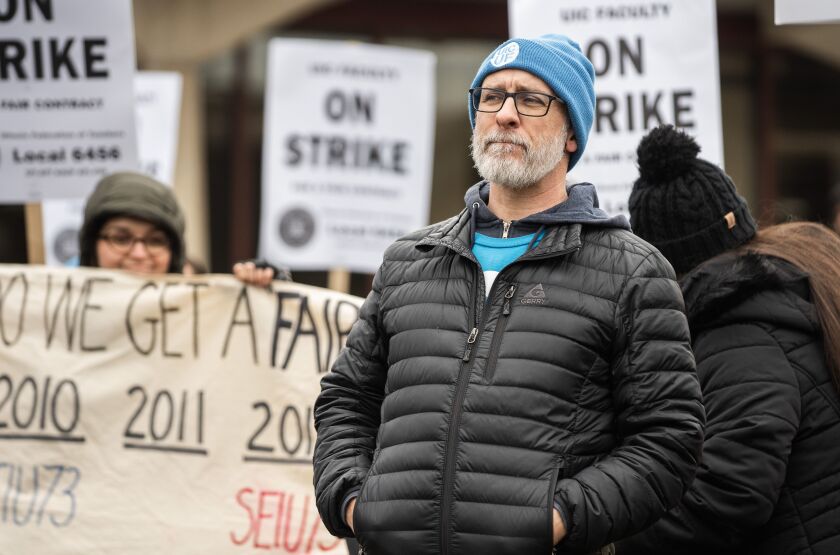 Aaron Krall, president of the UIC Faculty United union and English lecturer, speaks during a UIC Faculty United union strike at the University of Illinois Chicago.