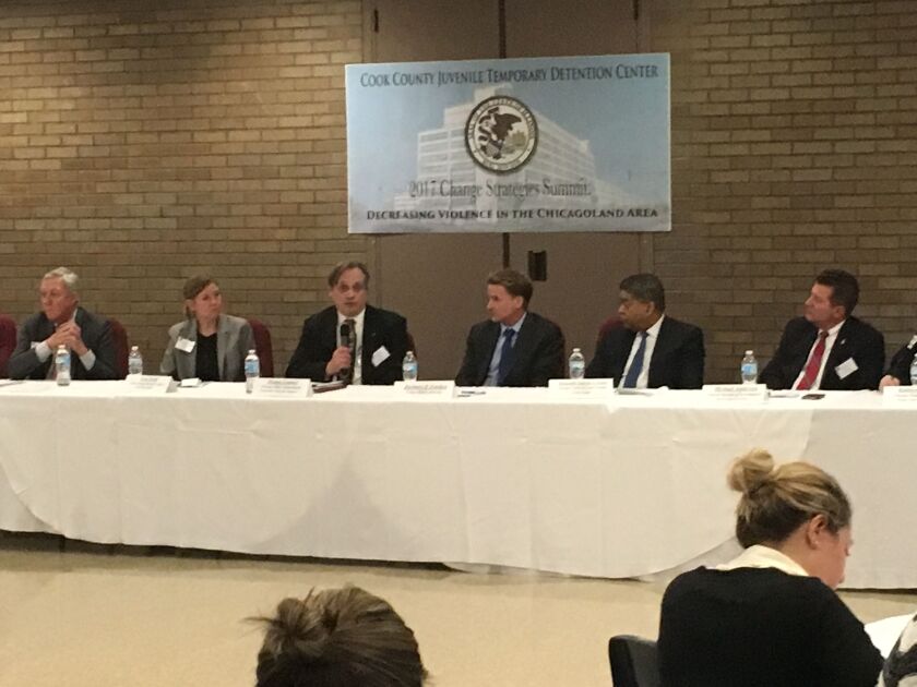 From left to right: George Sheldon head of the Department of Children and Family<br>Services for the state, Cara Smith, chief policy officer for Cook<br>County Sheriff Tom Dart, Thomas Lemmer, commander of youth<br>investigations for the Chicago Police De