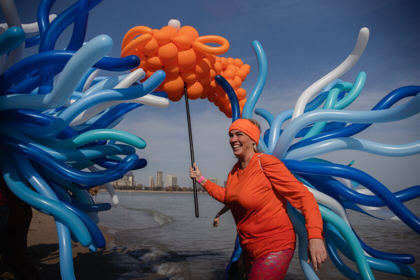 Thousands dive into the frigid waters of Lake Michigan at North Avenue Beach for the 20th annual Chicago Polar Plunge to benefit Special Olympics Chicago, Sunday morning, March 1, 2020.