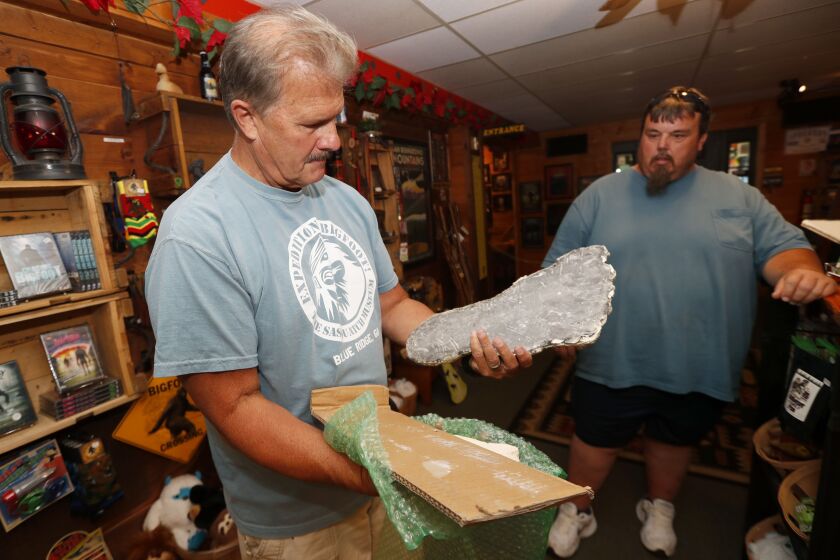 Bigfoot researcher David Bakara opens a box containing a plaster cast of footprints said to be from a Russian Bigfoot at Expedition: Bigfoot! The Sasquatch Museum in Cherry Log, Georgia.