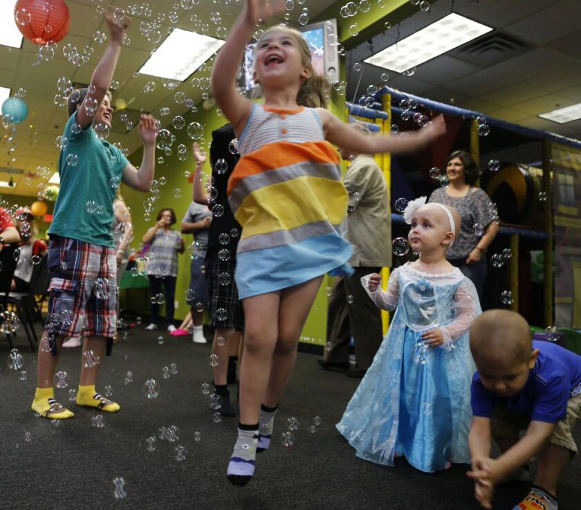 In this June 13 photo, Talia Pisano celebrates her second birthday with family and friends in Wheaton. AP photo