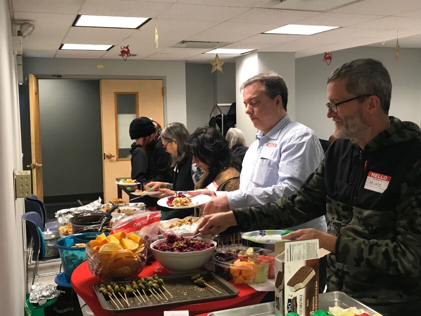 ChicagoVeg members enjoyed a vegan potluck in Uptown on Dec. 30 and celebrated their ranking as the third friendliest community for vegans and vegetarians worldwide by Meetup. | Taylor Hartz for the Sun-Times.