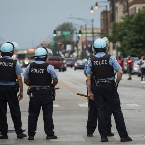 Chicago police officers respond to reports of looting and rioting near West Madison Street and South Keeler Avenue on the West Side, Monday afternoon, Aug. 10, 2020.