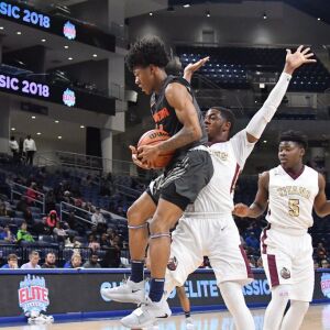 Evanston’s Jaheim Bolden (1) grabs a rebound. Worsom Robinson/For the Sun-Times.